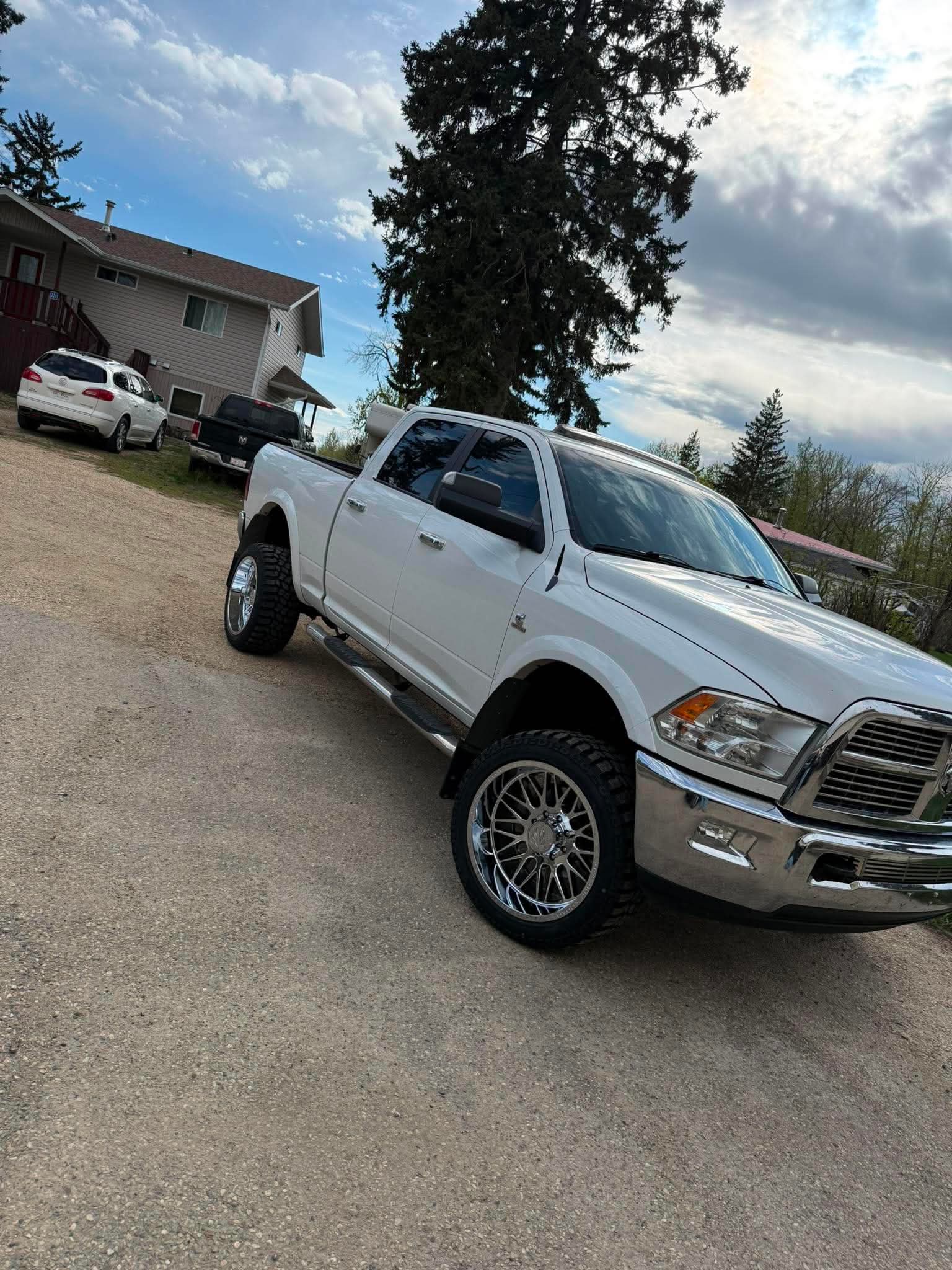 White Ram 2500 diesel lifted on chrome forged wheels