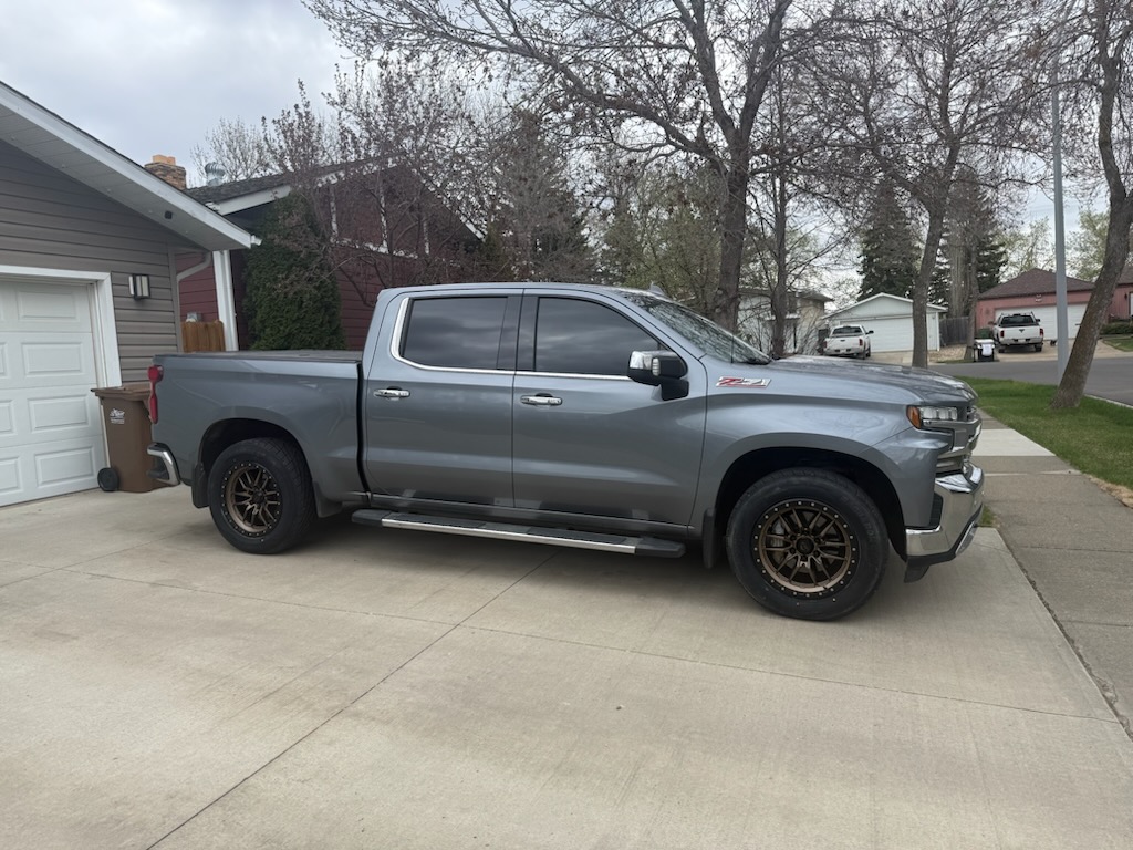 Gray Chevrolet Silverado Z71 on bronze beadlock-style wheels