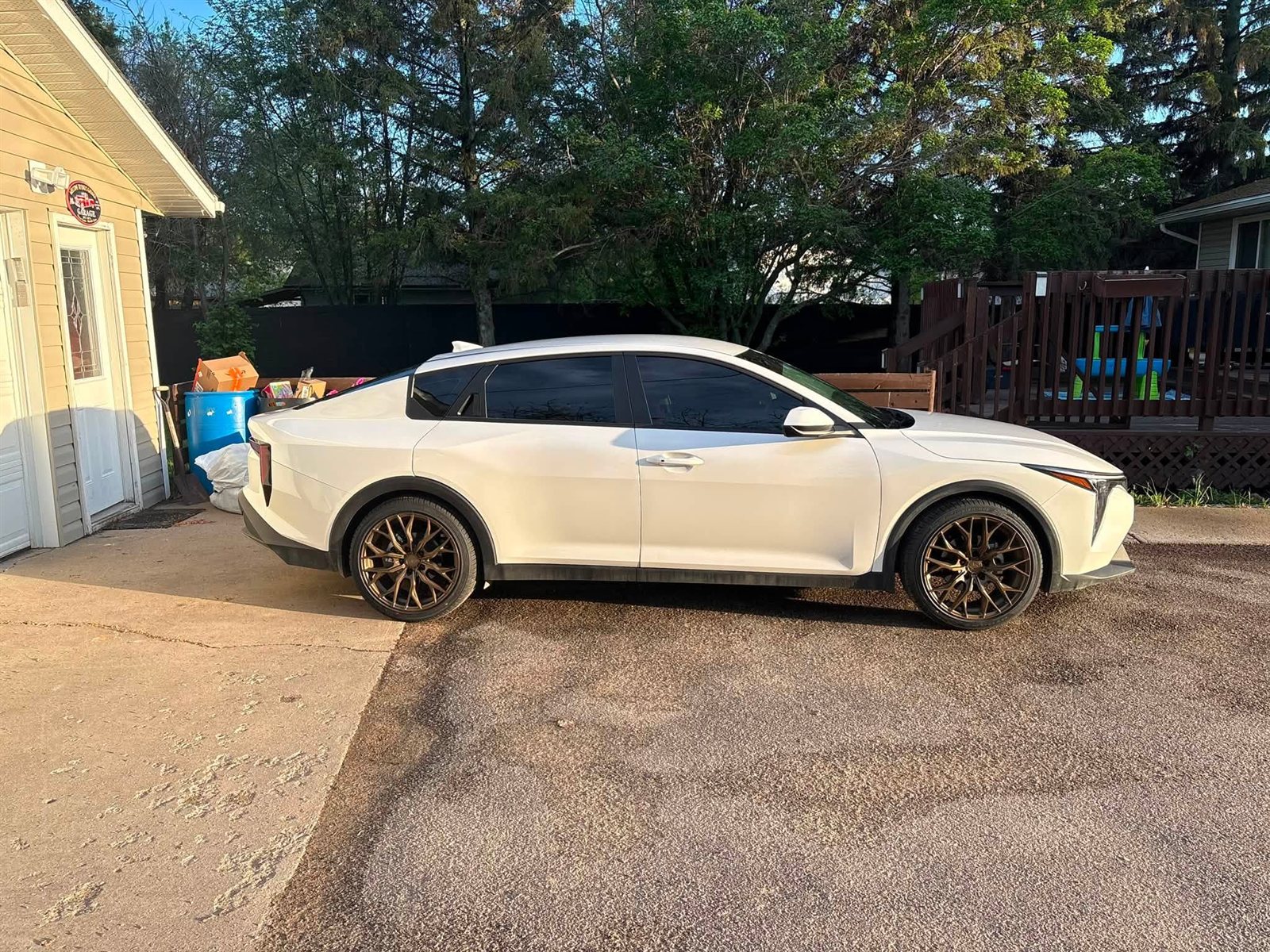 White Toyota Crown on bronze mesh wheels
